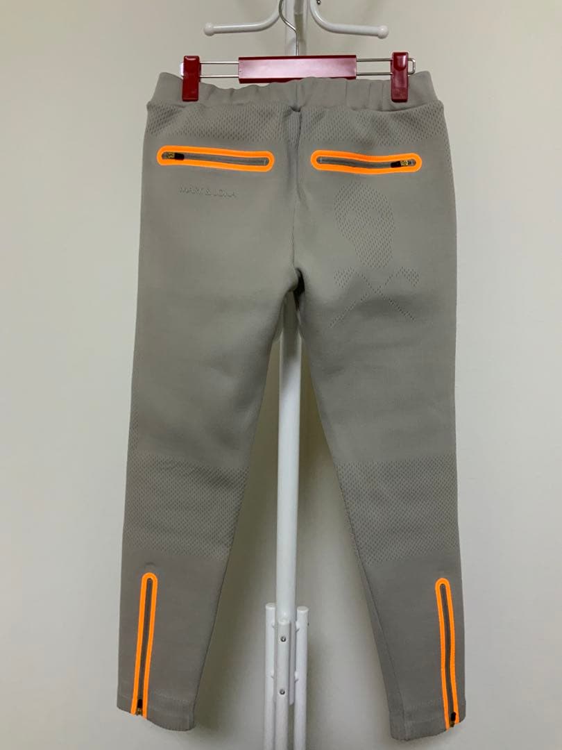 マークアンドロナレディースパンツ オレンジジッパー